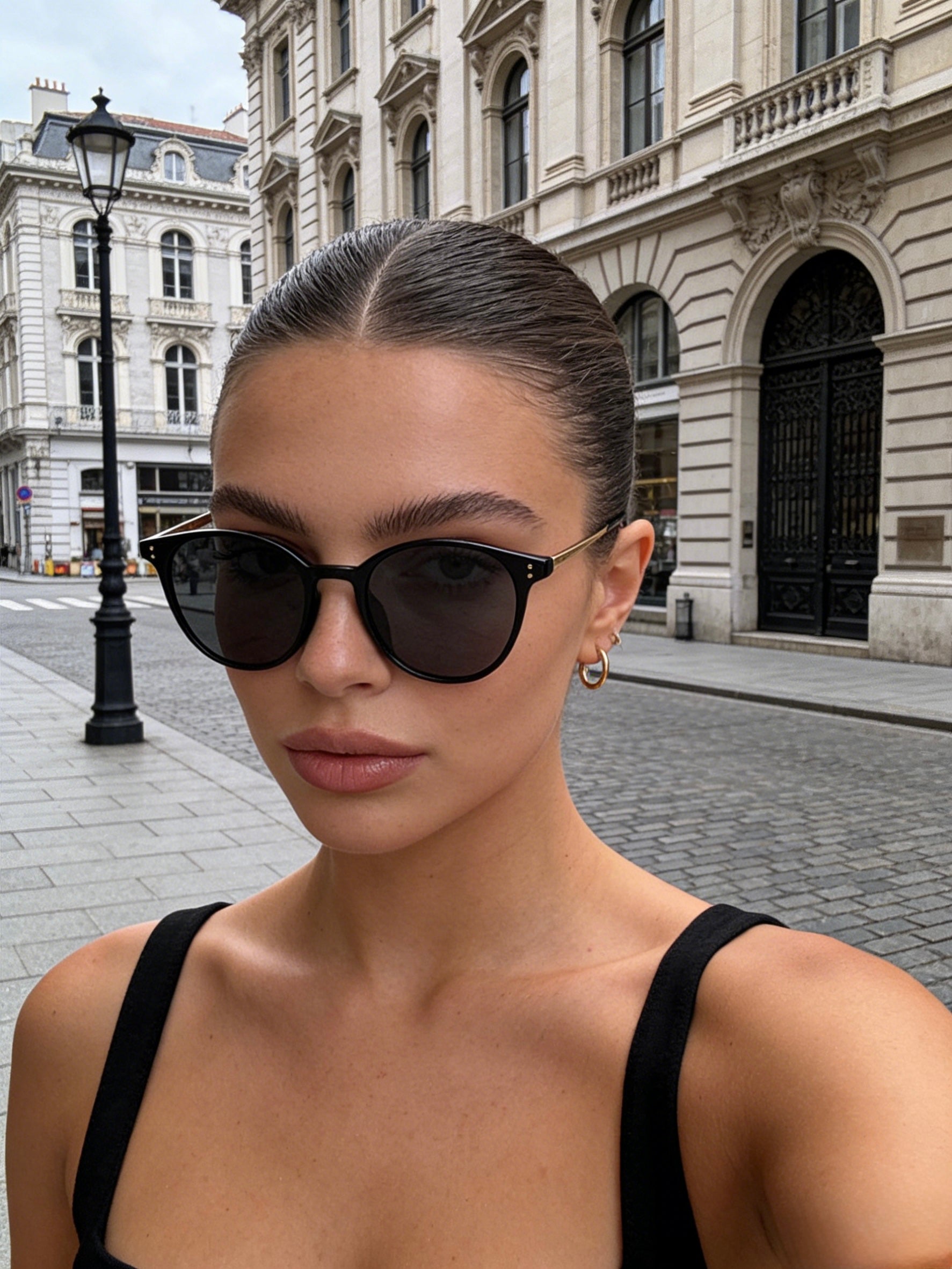 Pink Baby The Avent black sunglasses with sleek frames and dark lenses, designed for stylish eye protection.