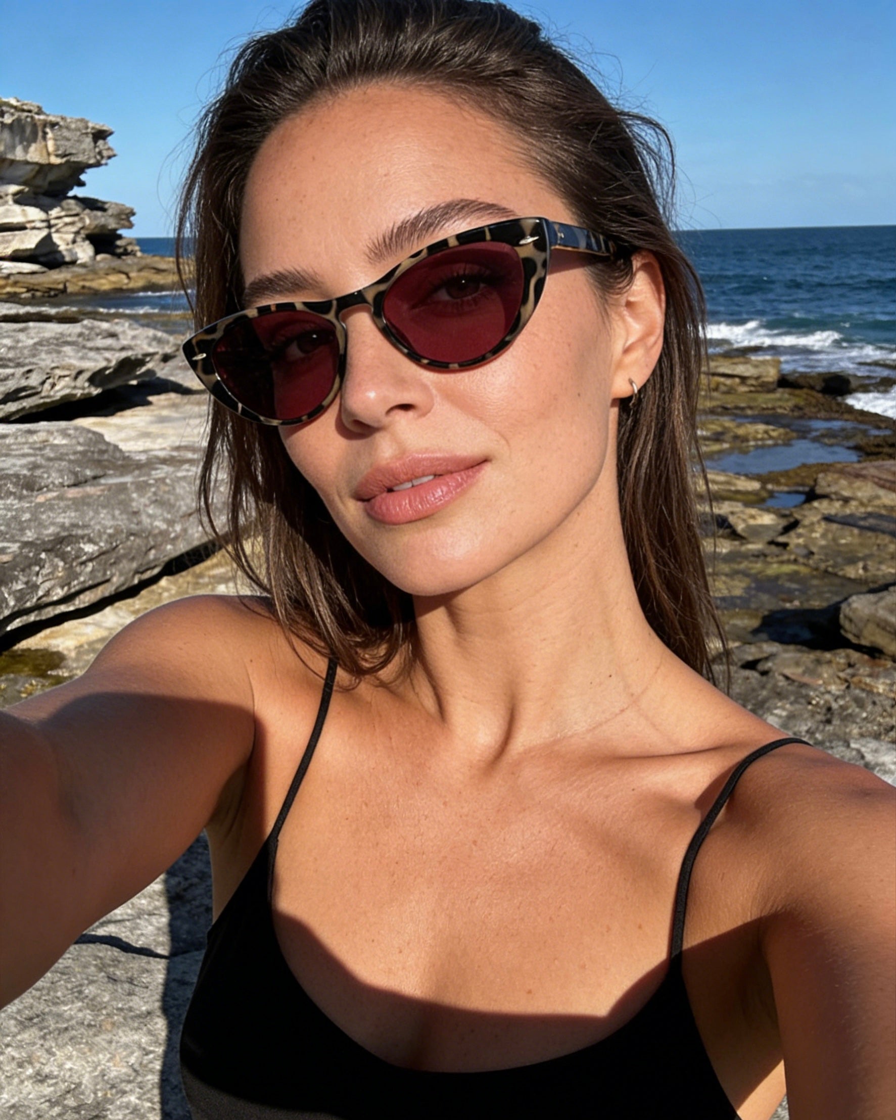 Pink Baby The Bailey tort sunglasses with round frames and dark lenses, stylish eyewear for sun protection.