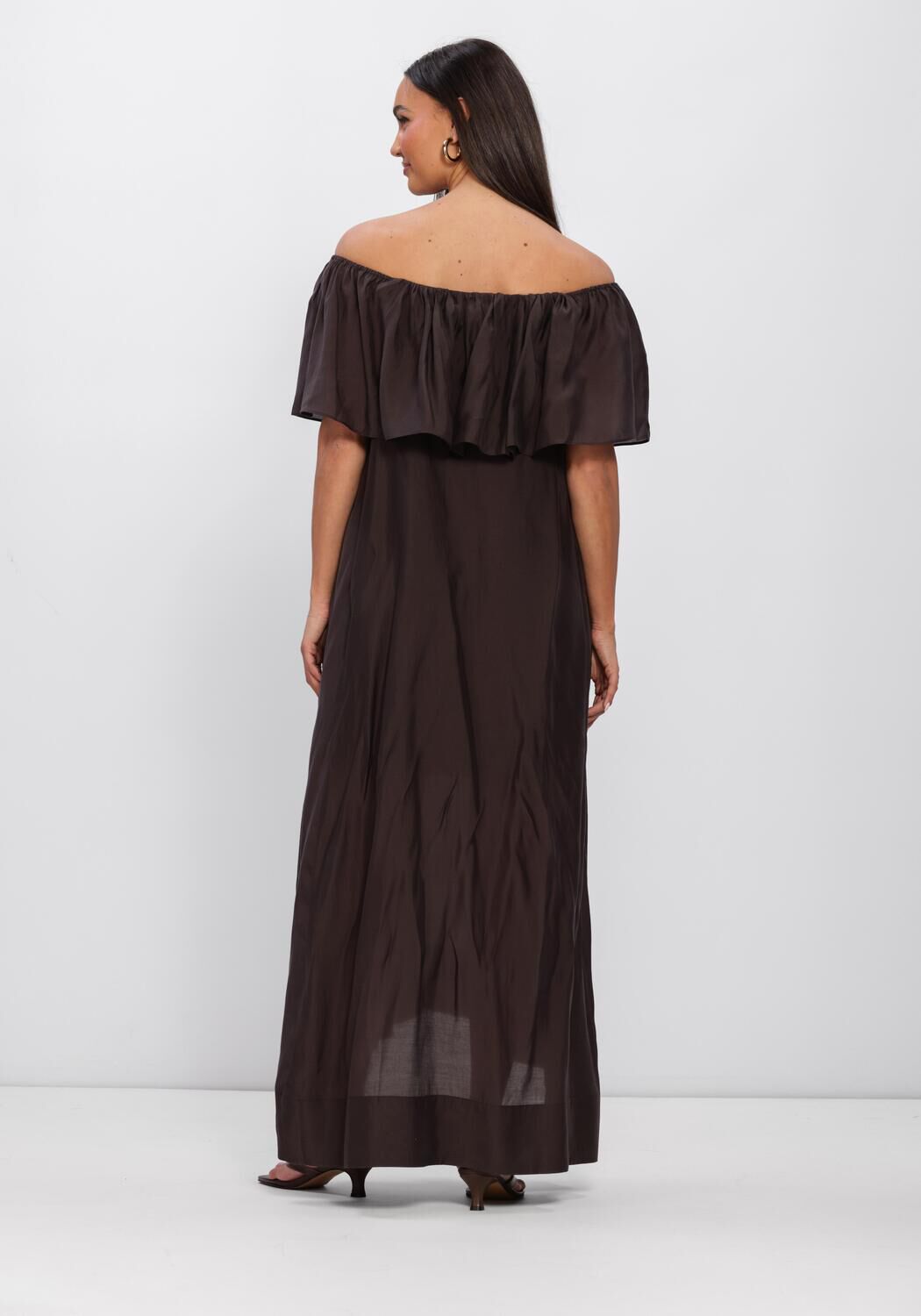 Pink Baby Serafina off-shoulder ruffle maxi dress in rich espresso brown, featuring flowing fabric and elegant design.