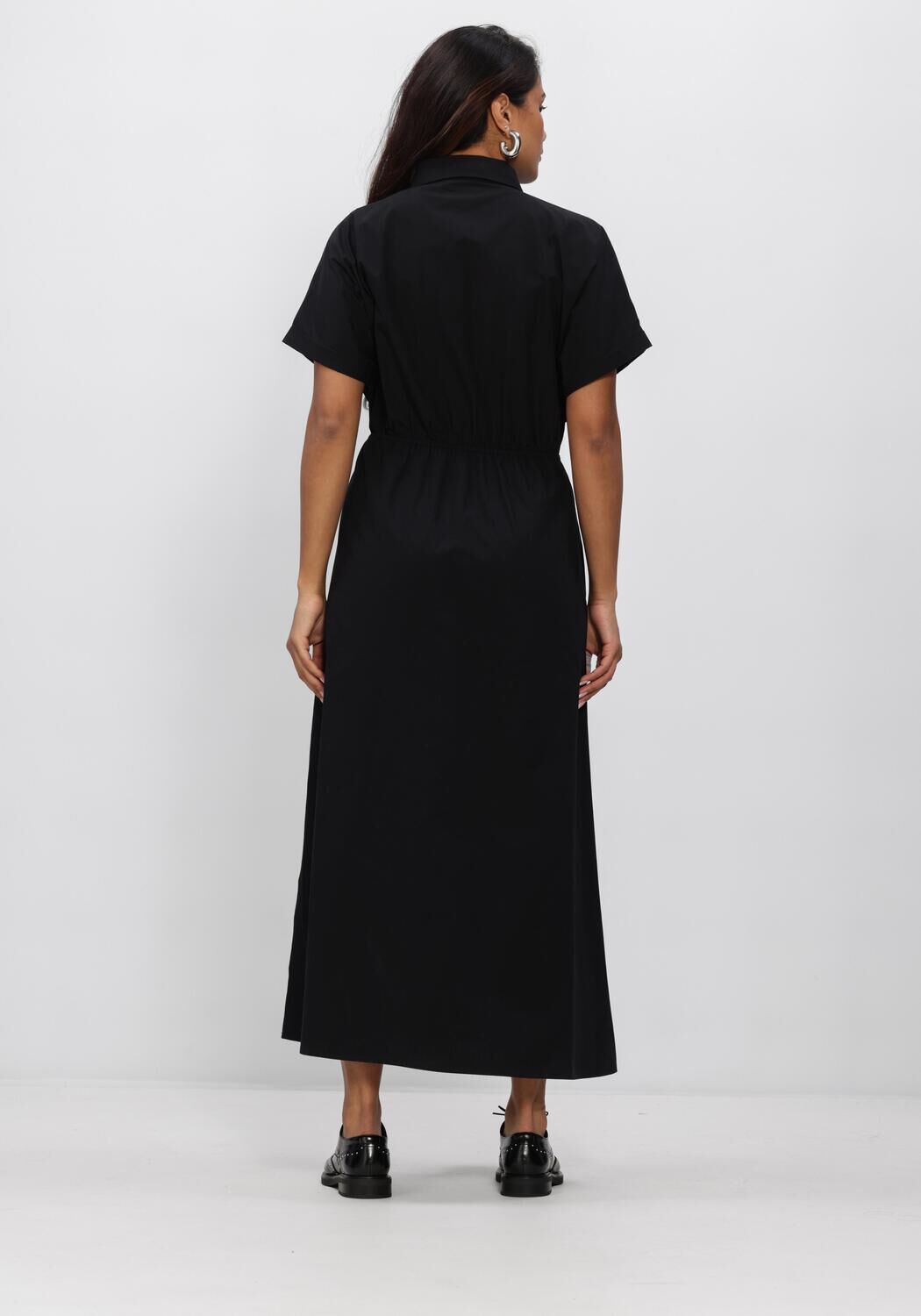 Black Celina tie-waist maxi dress by Pink Baby featuring a flowing silhouette and stylish neckline.
