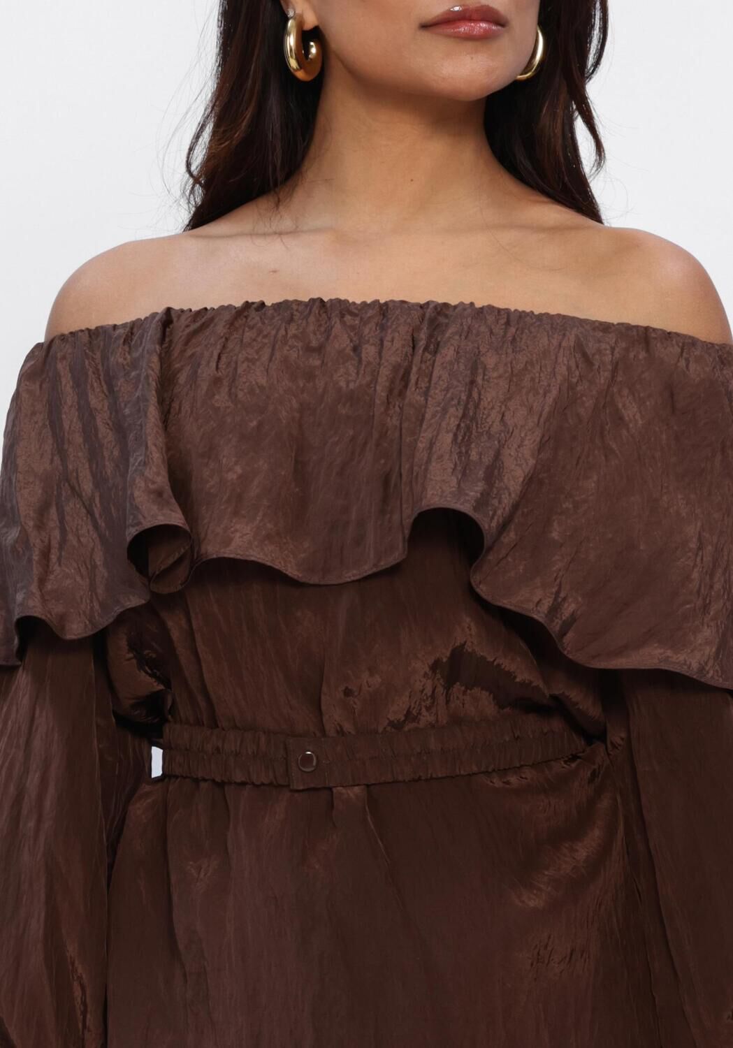 Pink Baby Rosalyn off-shoulder ruffle mini dress in chocolate brown, featuring a stylish off-shoulder design and ruffle details.