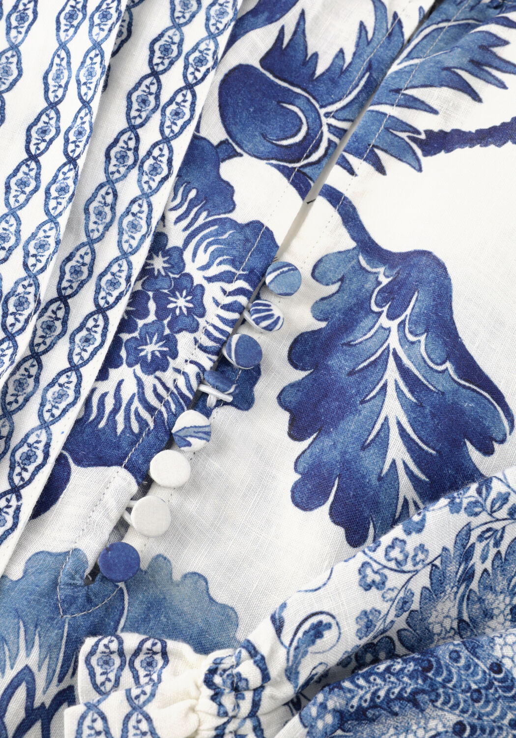 Isadora floral belted maxi dress in blue and white by Pink Baby, featuring a flowy design and waist belt for a stylish look.