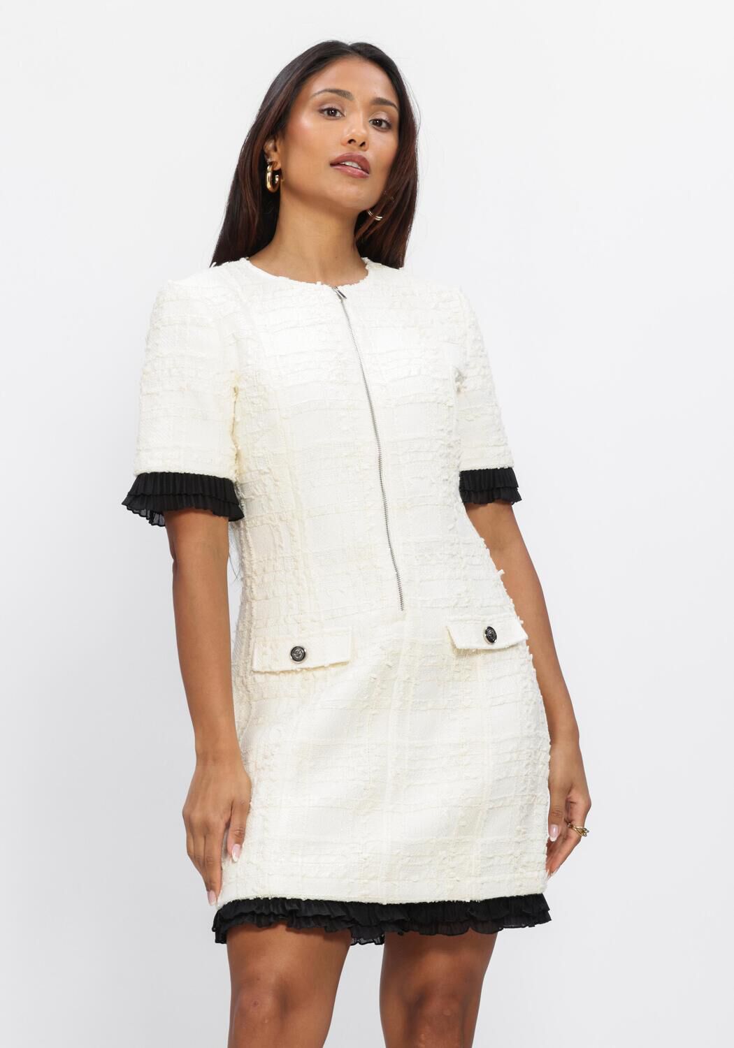Pink Baby Colette textured zip mini dress in ivory, featuring a fitted silhouette and stylish design, perfect for elegant occasions.