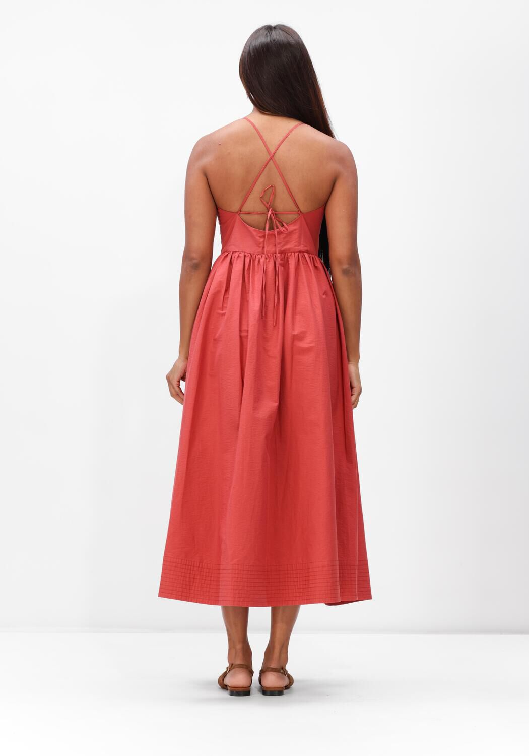 Pink Baby Camilla cross-back midi dress in coral fabric, featuring a stylish design and elegant length.