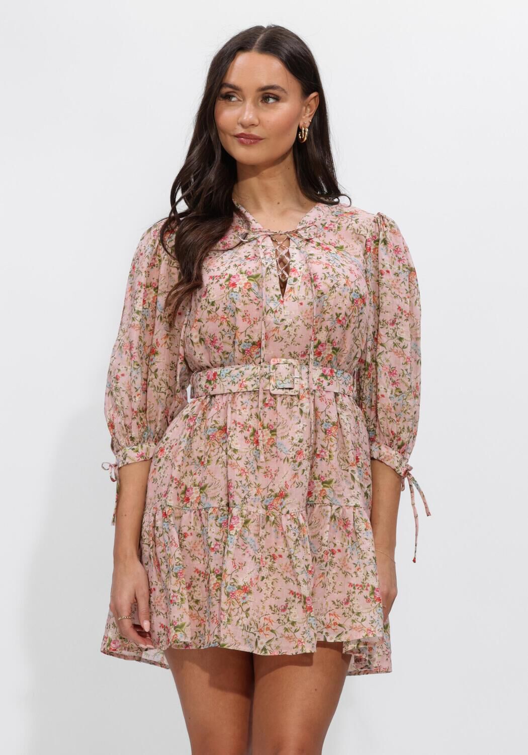 Pink Baby Eloisa belted floral mini dress in blush pink, featuring a fitted waist and delicate floral pattern.