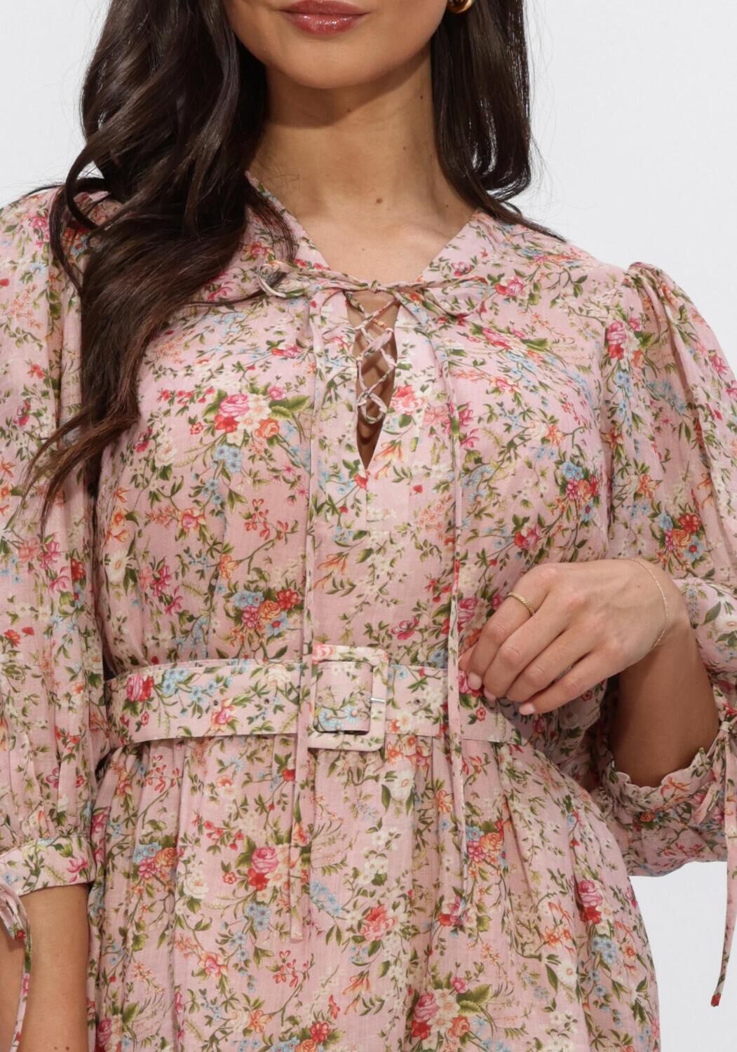 Pink Baby Eloisa belted floral mini dress in blush pink, featuring a feminine design and lightweight fabric.