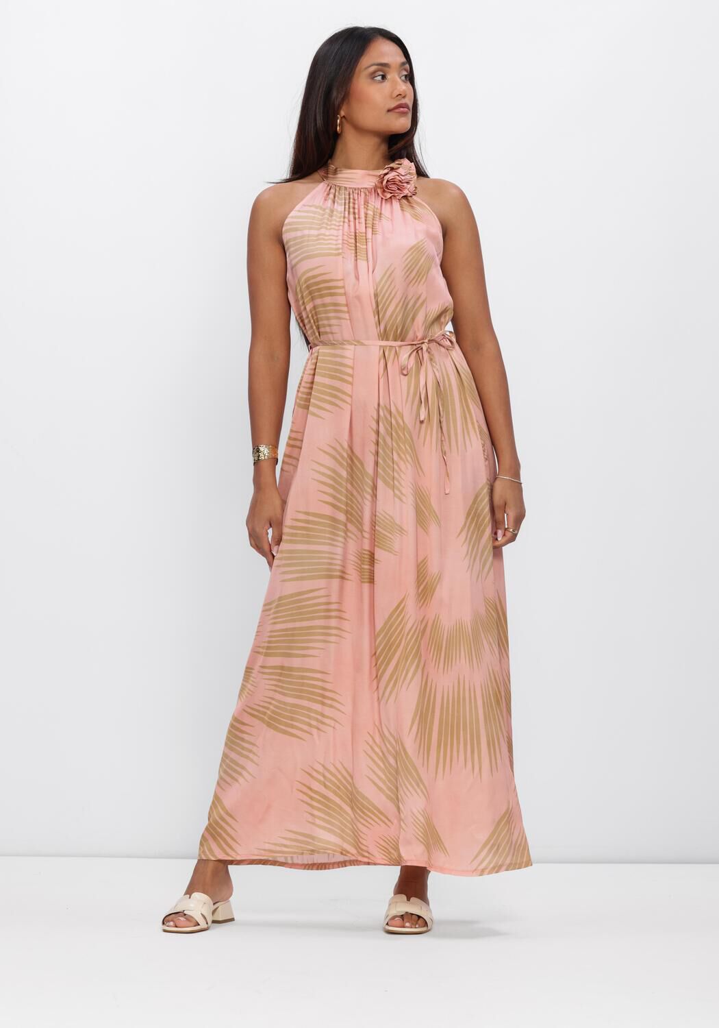 Pink Baby Samanta floral halter maxi dress in blush color with a flowy design and floral pattern on the fabric.
