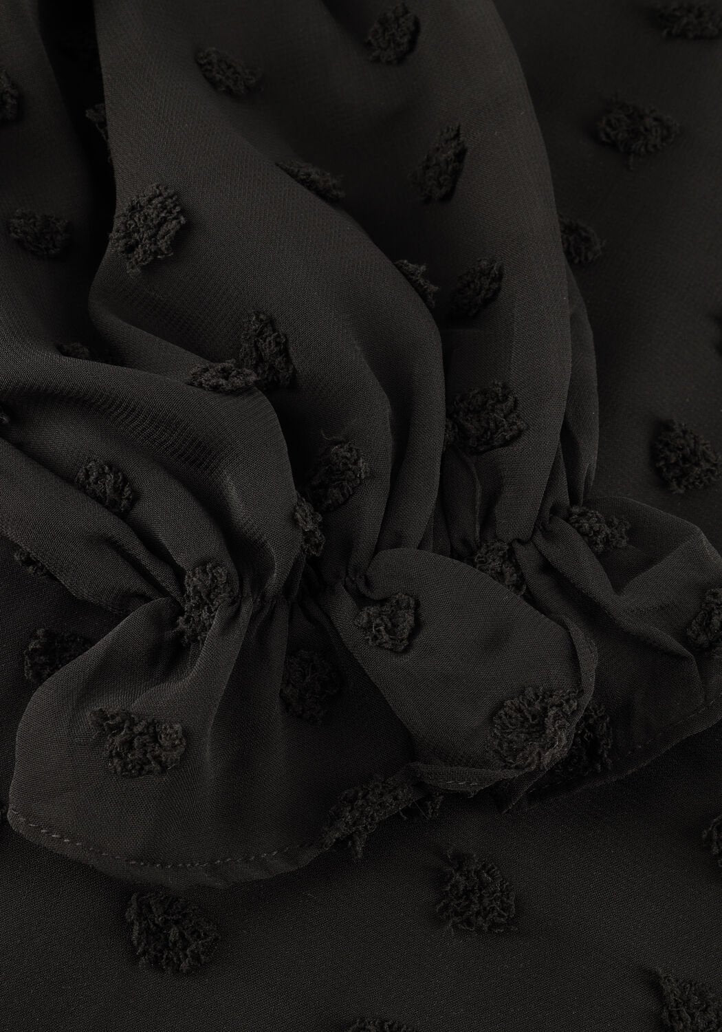 Black Emmanuelle Dobby Wrap Mini Dress by Pink Baby, featuring a stylish wrap design and fitted silhouette.