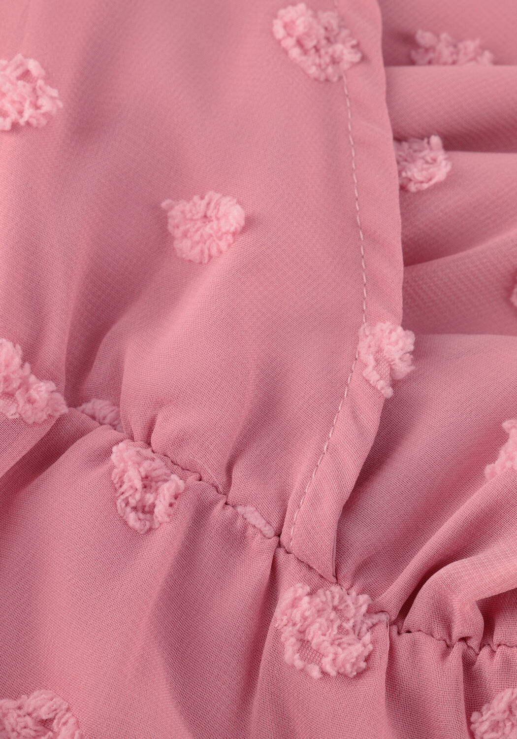 Pink Baby Rona Dobby Wrap Mini Dress in blush pink fabric, featuring a stylish wrap design and short sleeves.