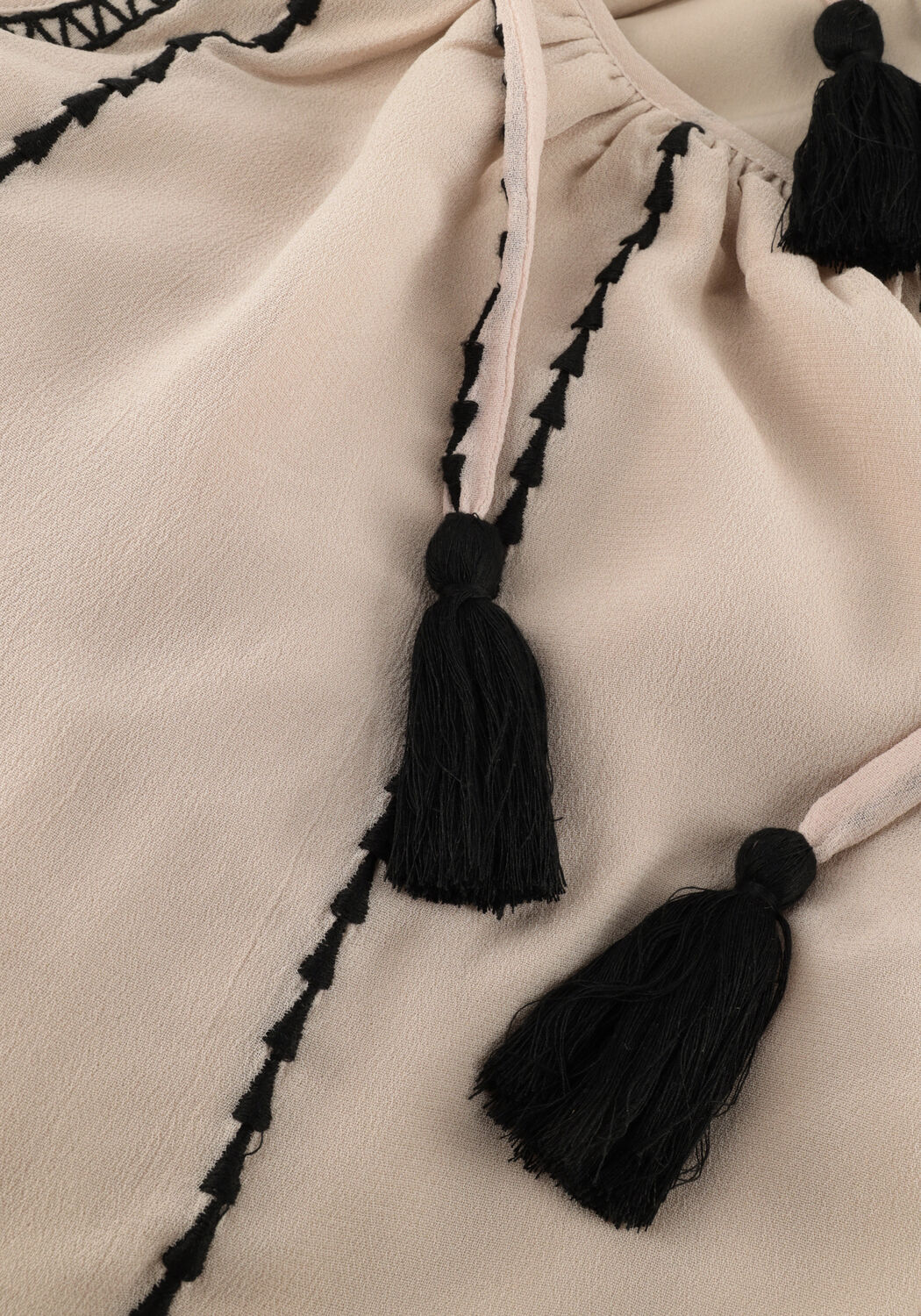 Pink Baby Adorn tassel-tie tiered maxi dress in beige and black, featuring layered fabric and stylish tassel details.
