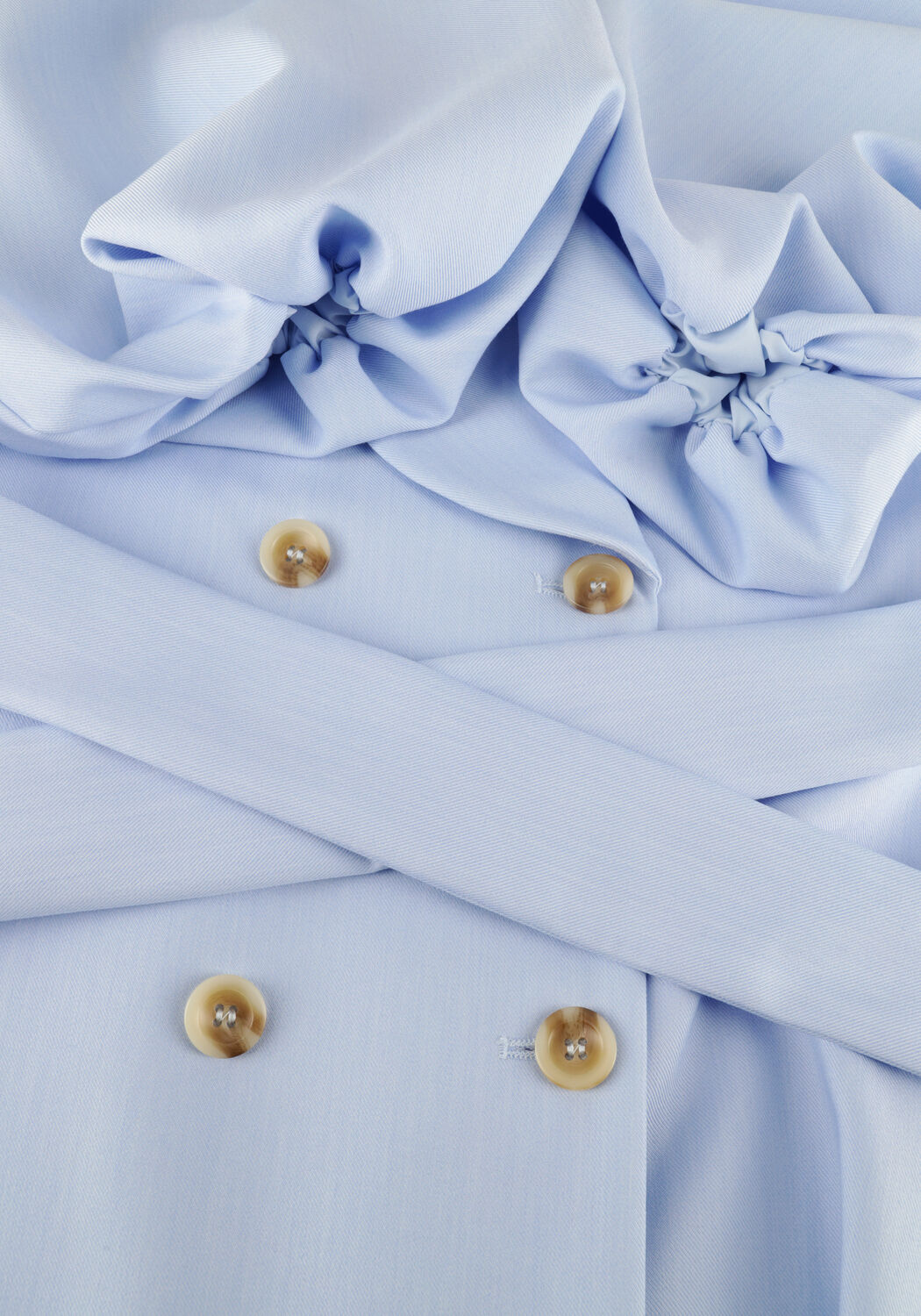 Pink Baby powder blue belted blazer mini dress displayed on a hanger, showcasing its tailored fit and stylish design.