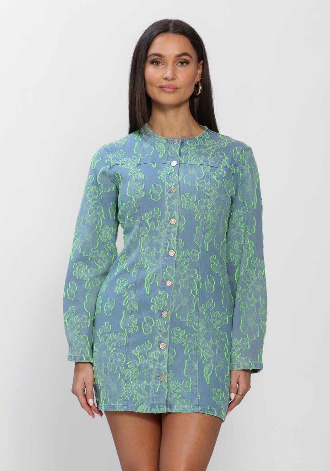 Pink Baby Freya floral denim mini dress in blue and green, featuring a stylish floral pattern and casual denim design.