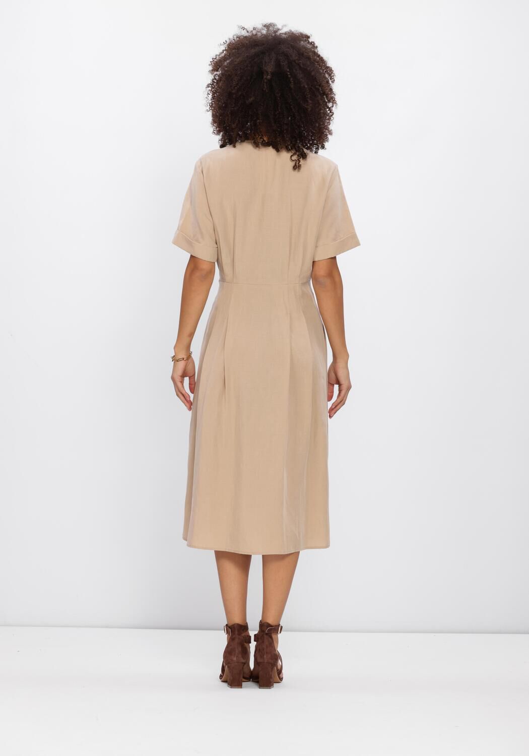 Pink Baby Camille buckle wrap midi dress in beige, featuring a stylish wrap design and buckle detail on the front.