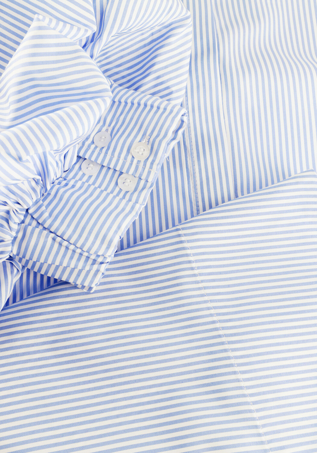 Pink Baby Christine striped puff sleeve shirt dress in blue, featuring a relaxed fit and stylish design.