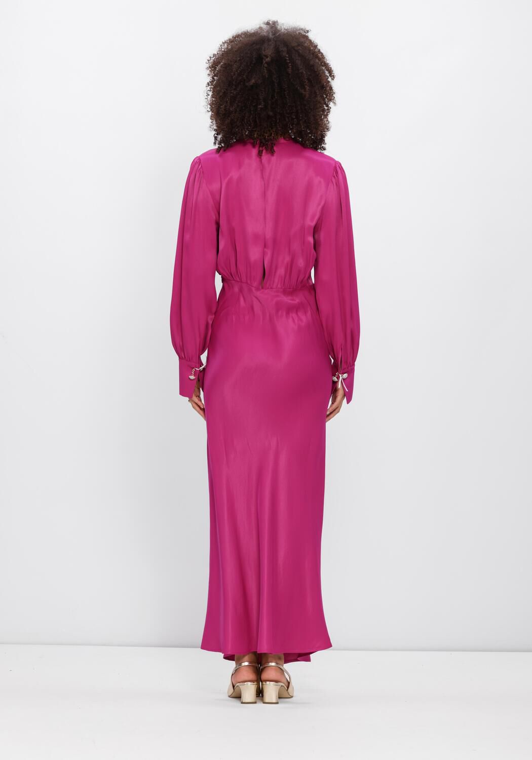 Pink Baby Fiorella satin V-neck maxi dress in fuchsia color, flowing fabric with elegant design and sleeveless style.