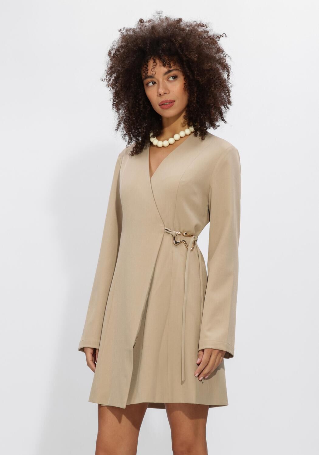 Beige Cindy buckle-detail wrap mini dress by Pink Baby, featuring a stylish V-neck and fitted silhouette.