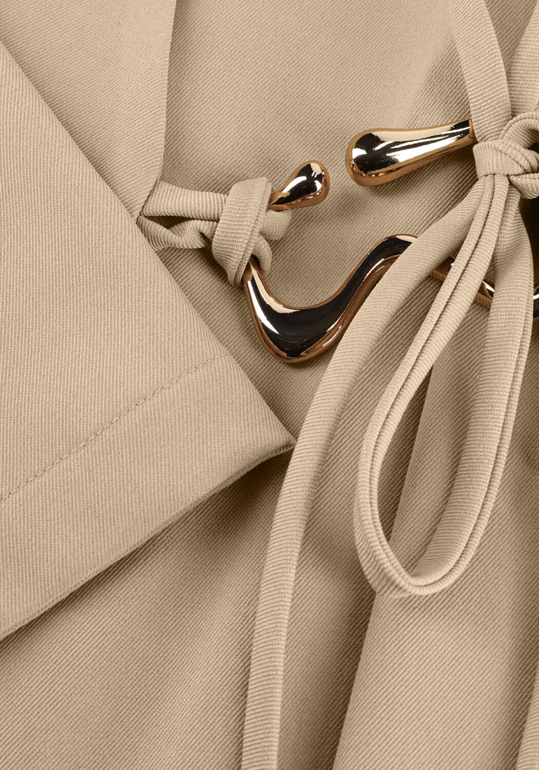 Beige Cindy Buckle-Detail Wrap Mini Dress by Pink Baby, showcasing the buckle accents and stylish wrap design.