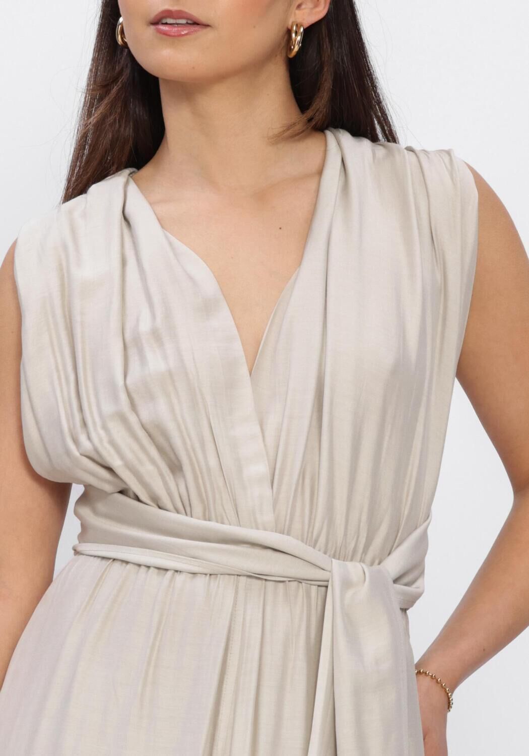 Beige Valentina pleated cross-back maxi dress by Pink Baby, featuring flowing fabric and elegant design suitable for summer wear.