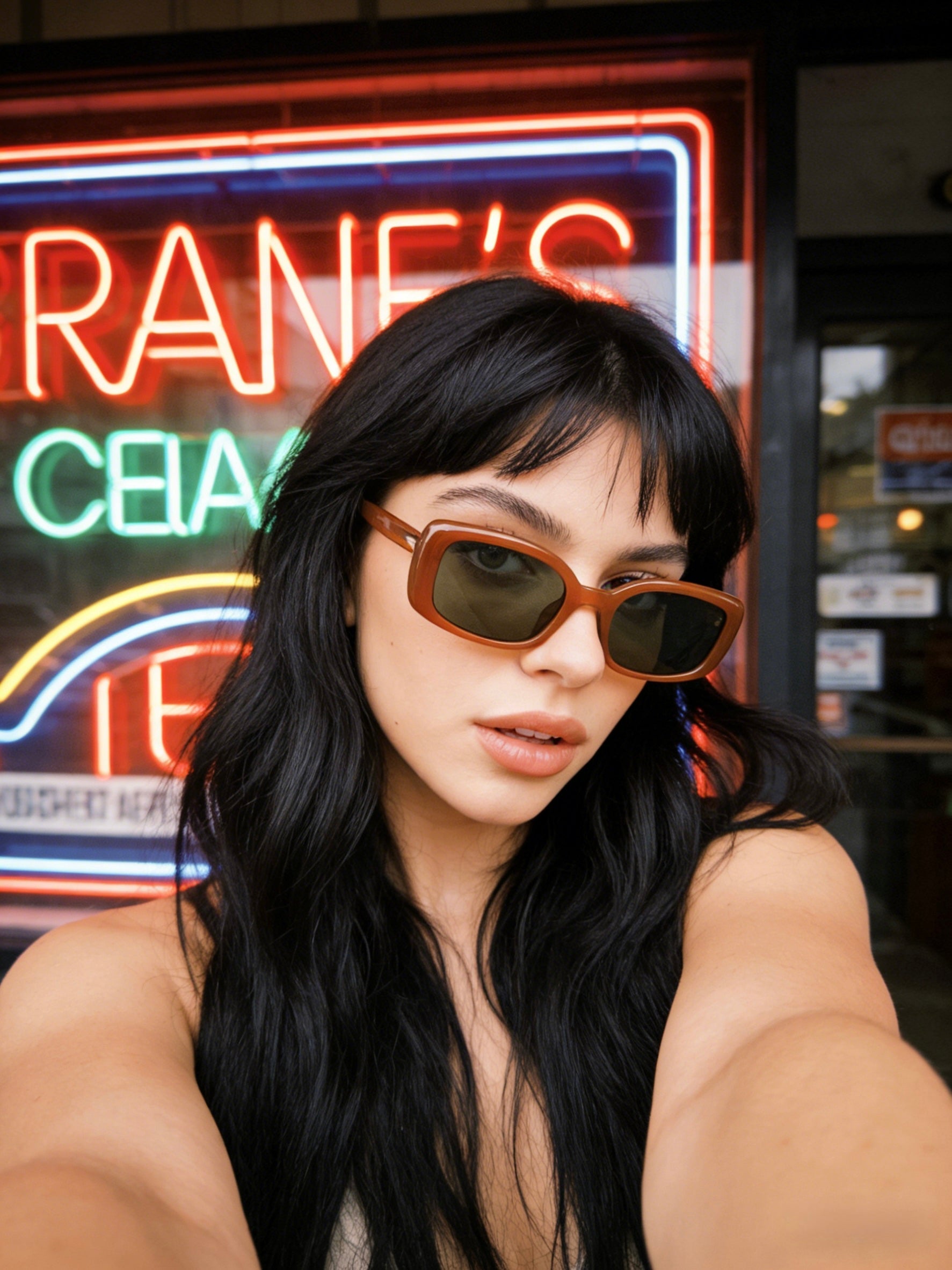 Pink Baby The Fern caramel sunglasses with rounded frames and dark lenses, stylish and fashionable eyewear for sunny days.