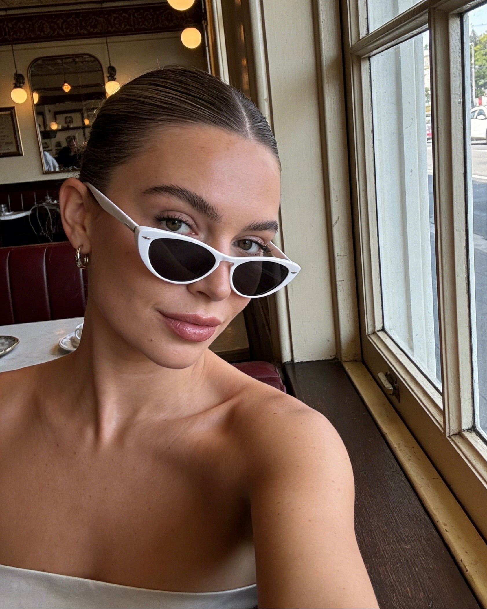 Pink Baby The Bailey white sunglasses with round frames and tinted lenses, stylish accessories for sunny days.
