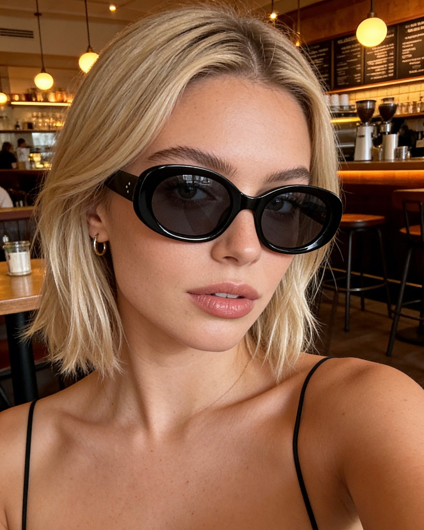 Pink Baby The Flynn black sunglasses with sleek frame and tinted lenses, stylish eyewear for sun protection.