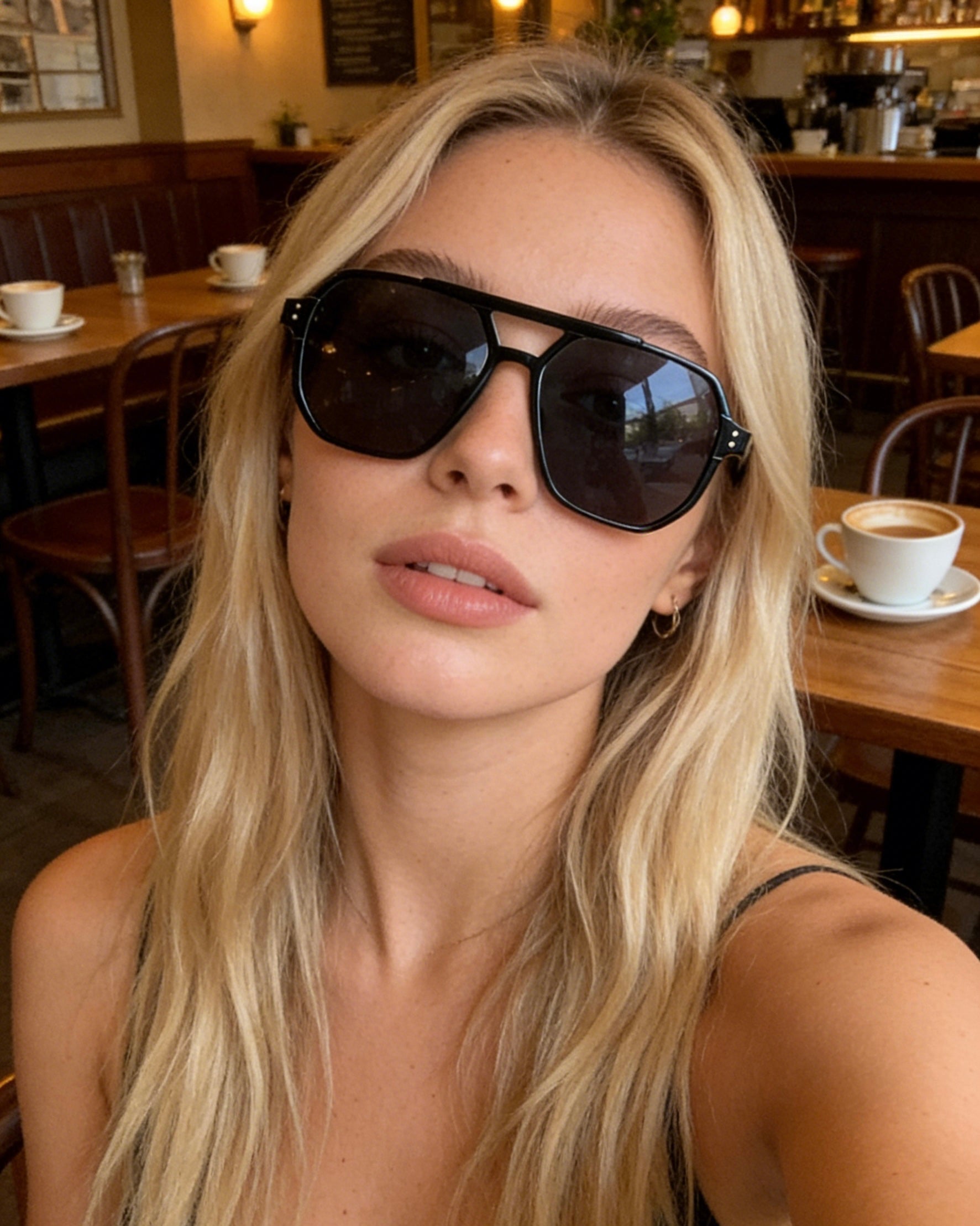 Pink Baby The Blake sunglasses with round pink frames and tinted lenses, stylish eyewear for a trendy look.