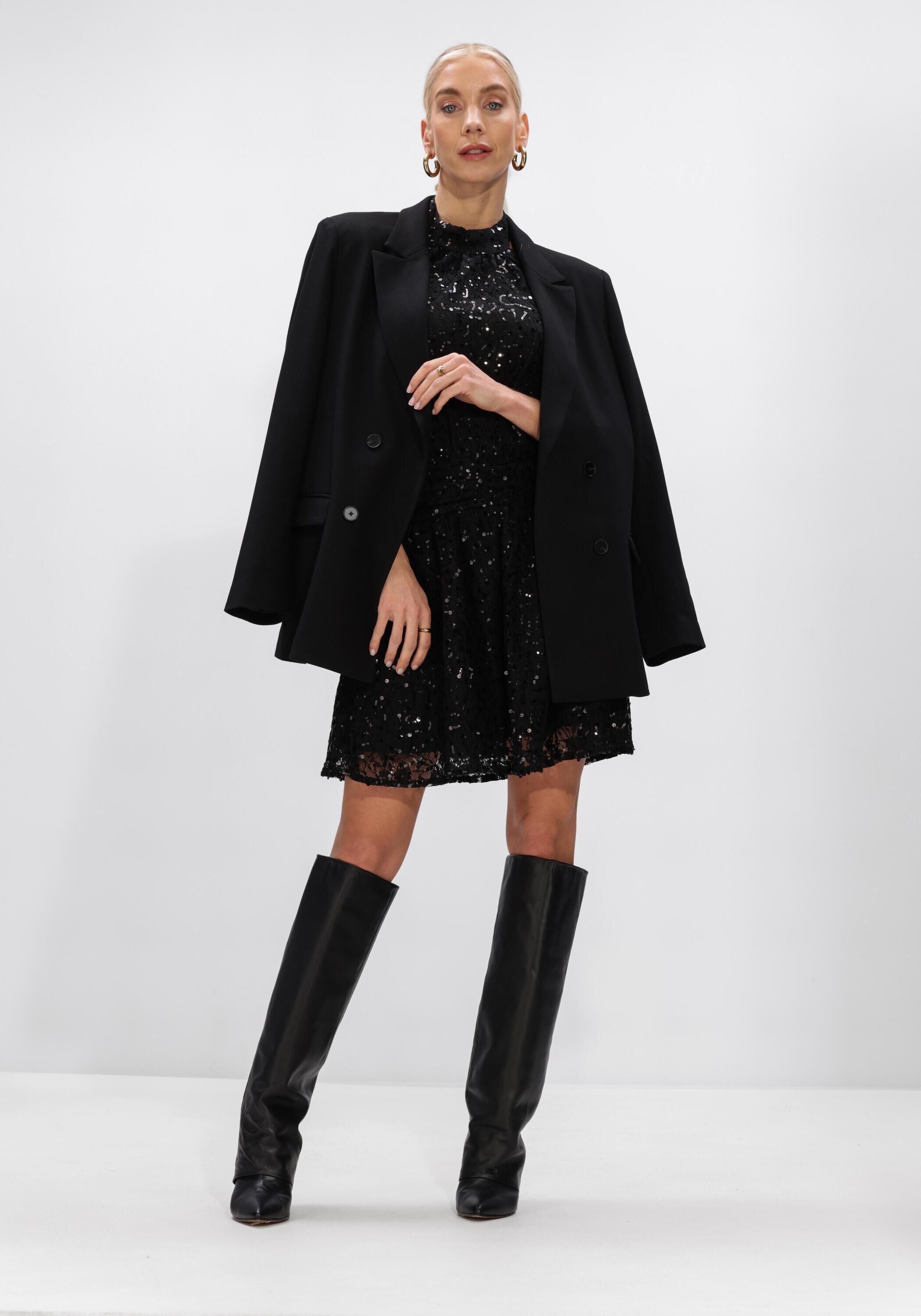 Black Pink Baby Doha sequin halterneck mini dress displayed on a hanger with detailed sequin embellishments.