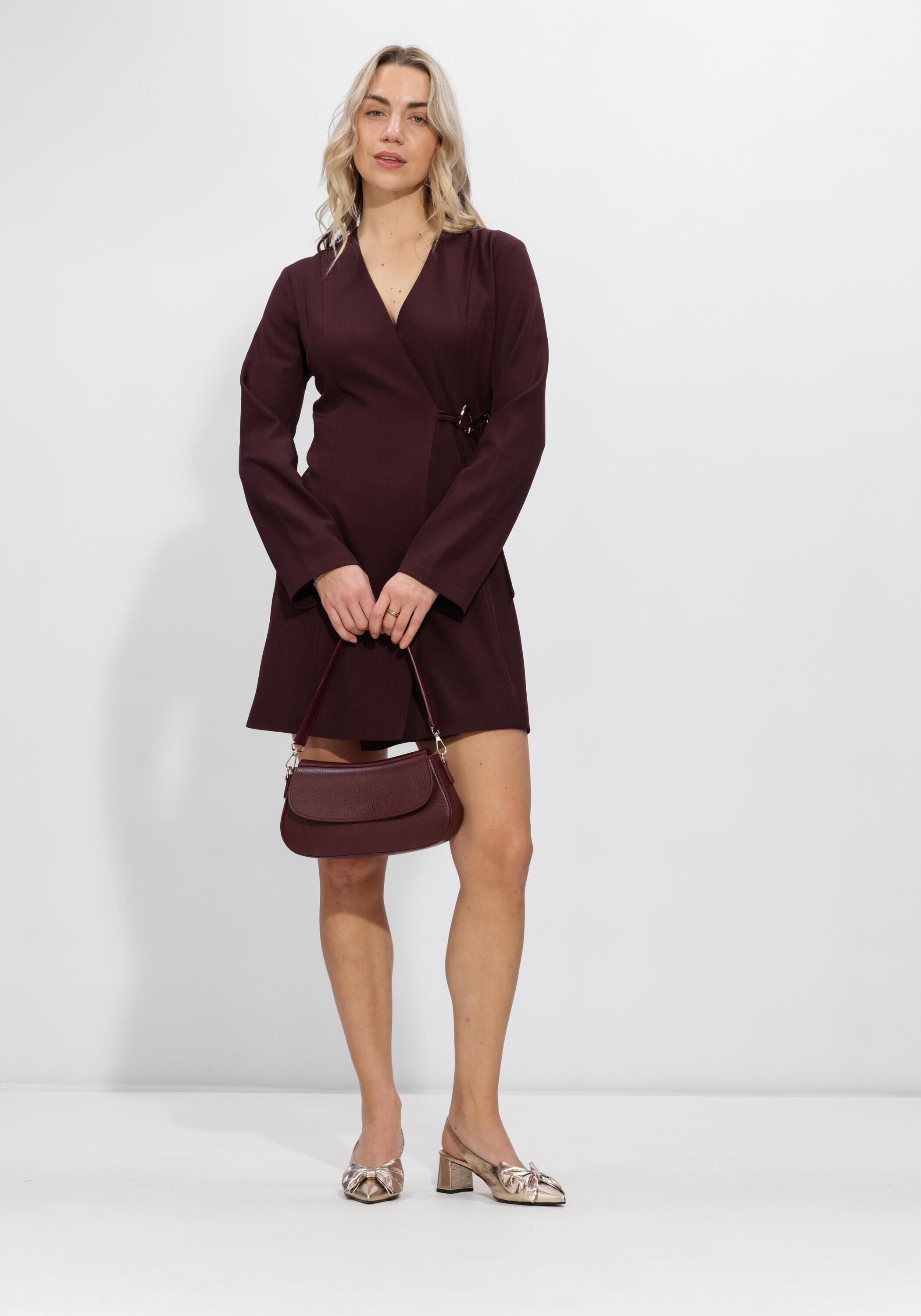 Pink Baby Viviana hardware wrap mini dress in burgundy, featuring a fitted silhouette and stylish hardware details.