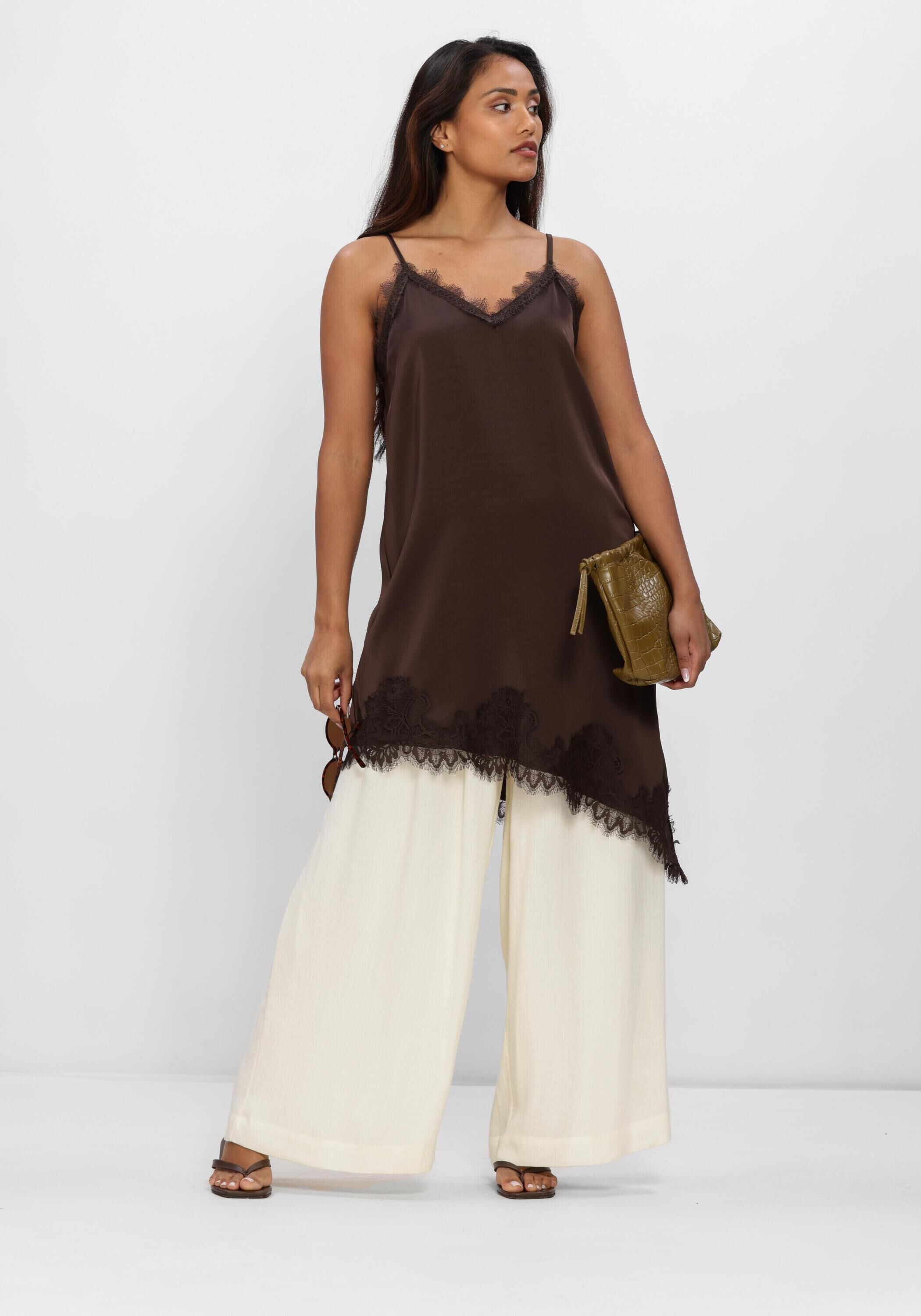 Pink Baby Charlotte brown satin slip dress with lace trim, featuring a smooth satin fabric and delicate lace detailing at the neckline.