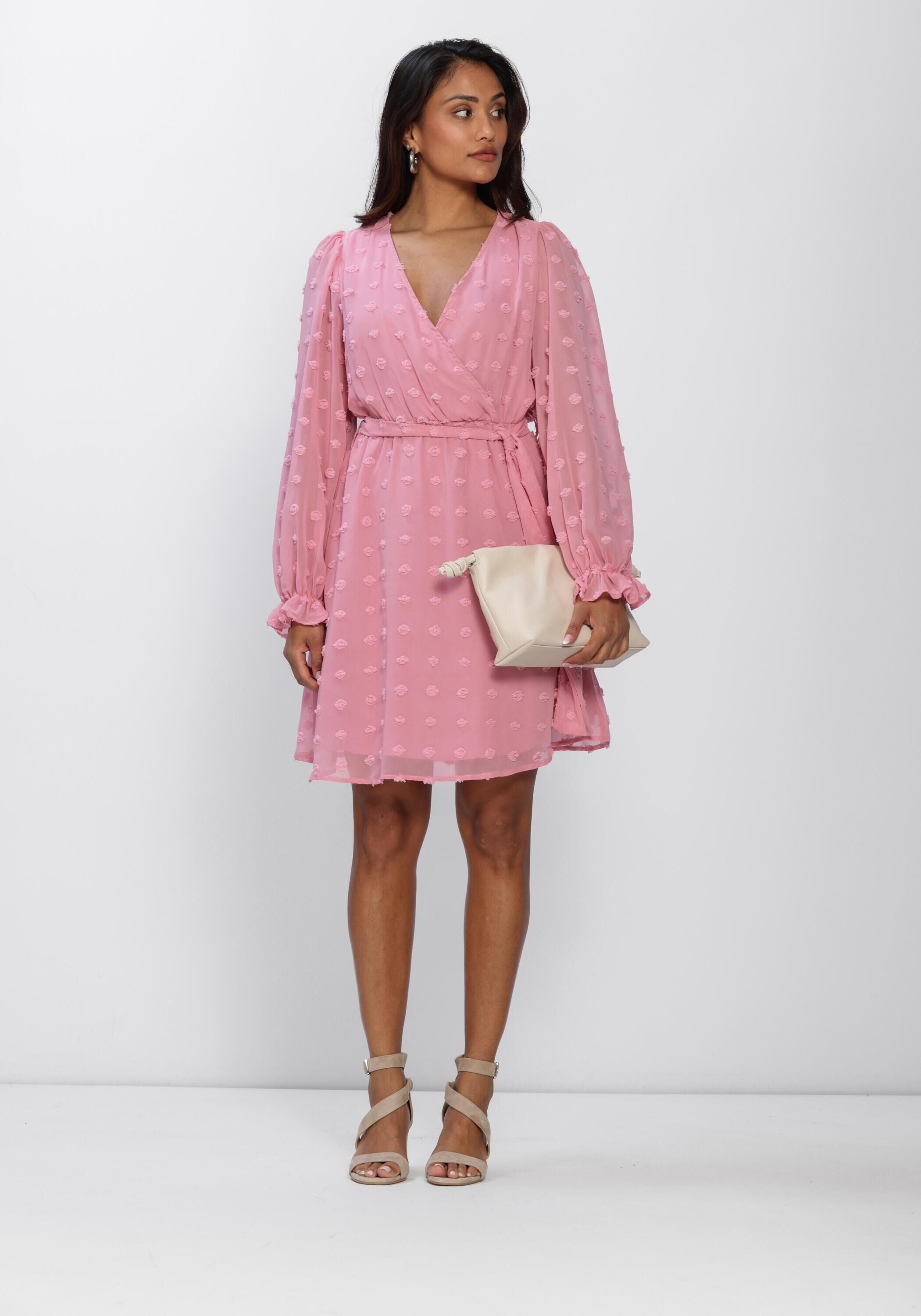 Pink Baby Rona Dobby Wrap Mini Dress in blush pink, showcasing a stylish wrap design and elegant fabric.