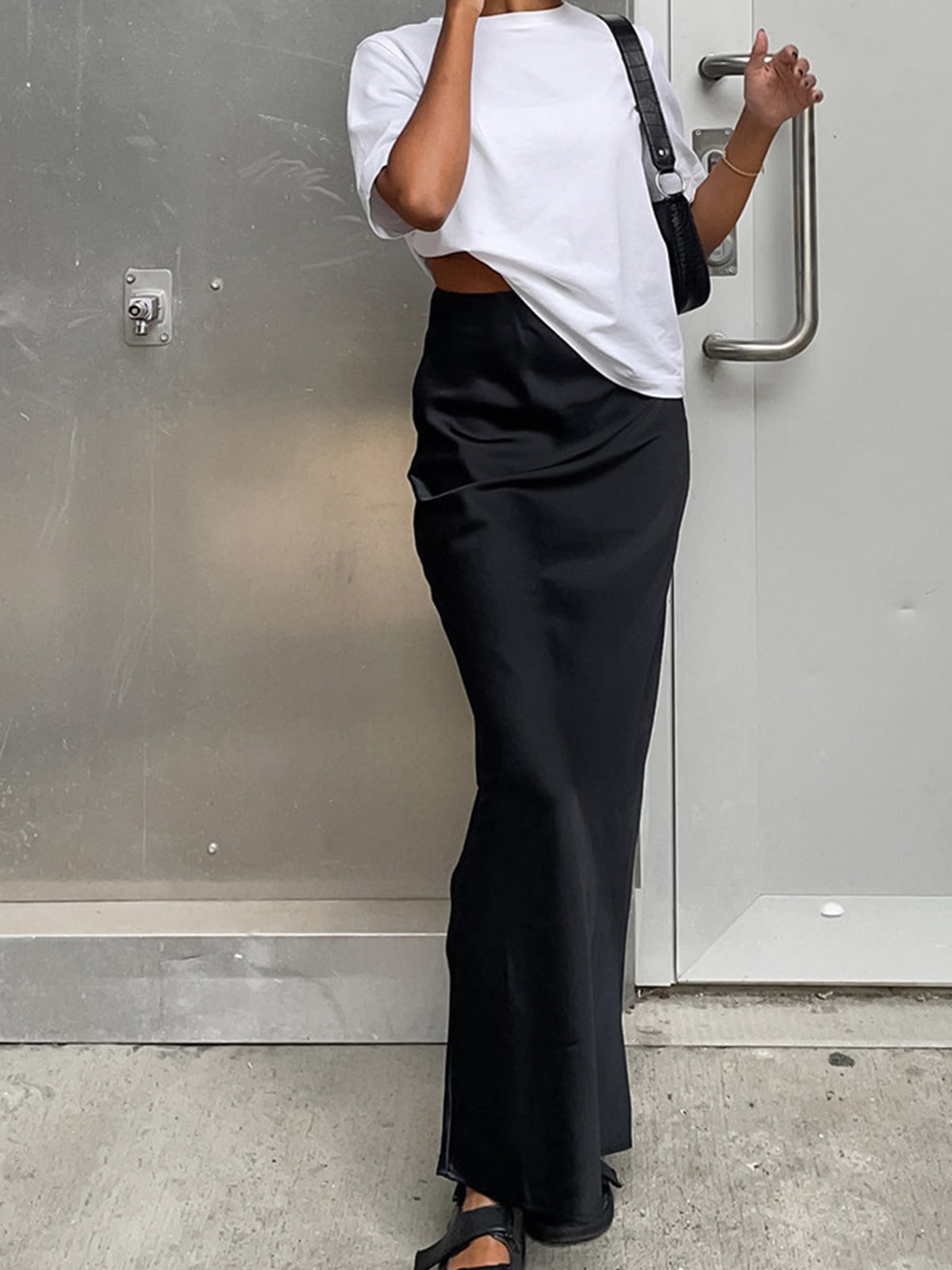 Pink Baby satin maxi skirt with a smooth, shiny fabric and flowing design, perfect for casual or dressy occasions.