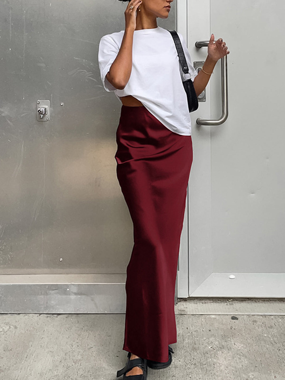 Pink Baby utility satin maxi skirt with a flowy design, featuring smooth satin fabric and a comfortable waist fit.