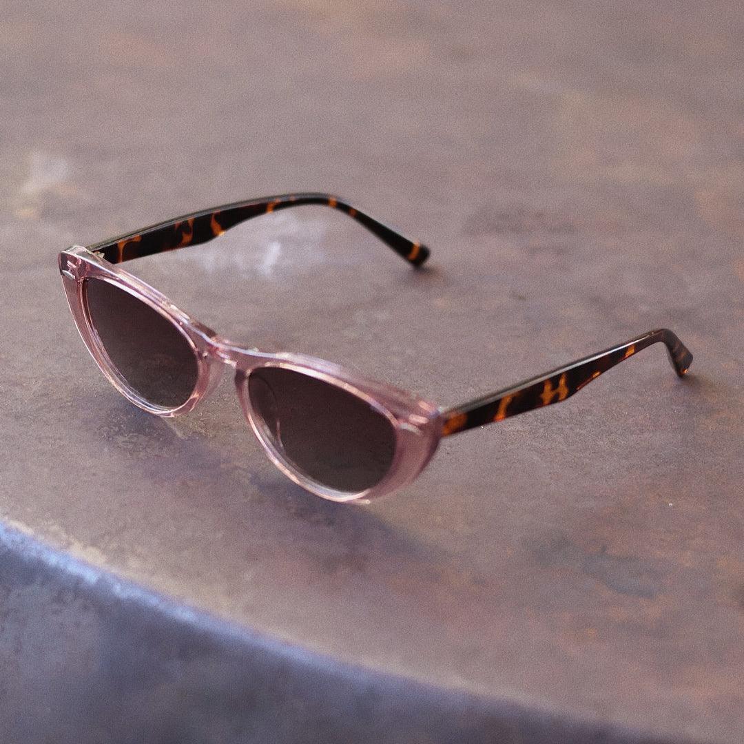 Pink Baby The Bailey pink sunglasses with rounded frames and UV protection, stylish accessory for kids.