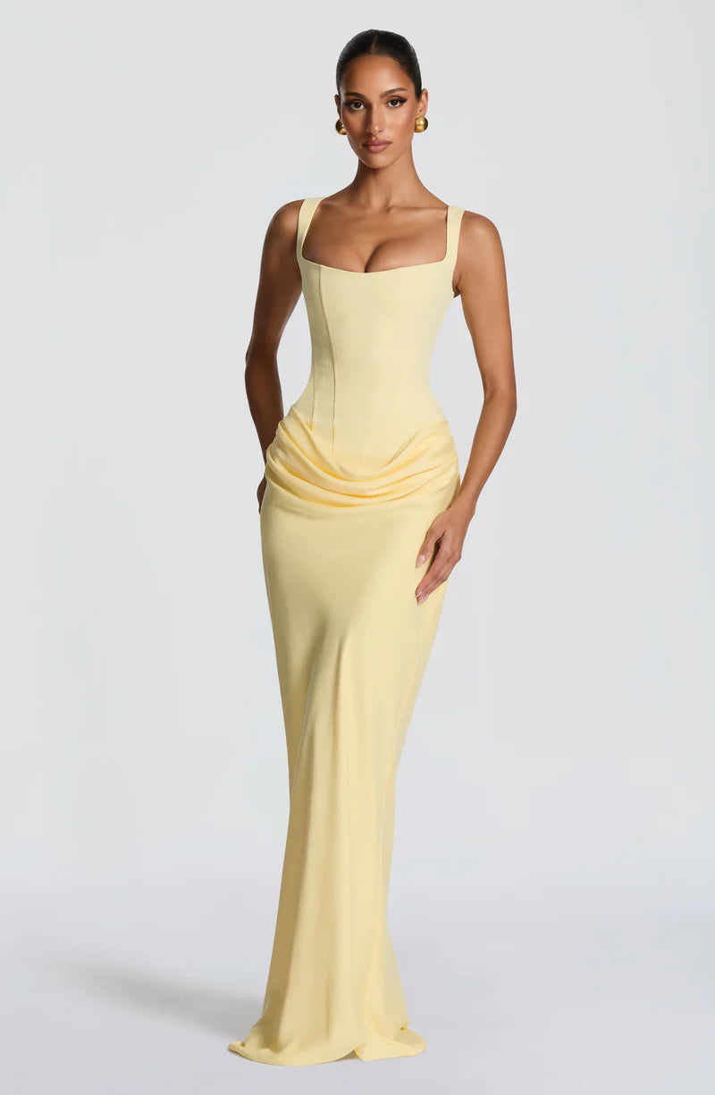 Pink Baby Lila Maxi Dress in lemon color featuring a flowing design, perfect for stylish summer or special occasions.