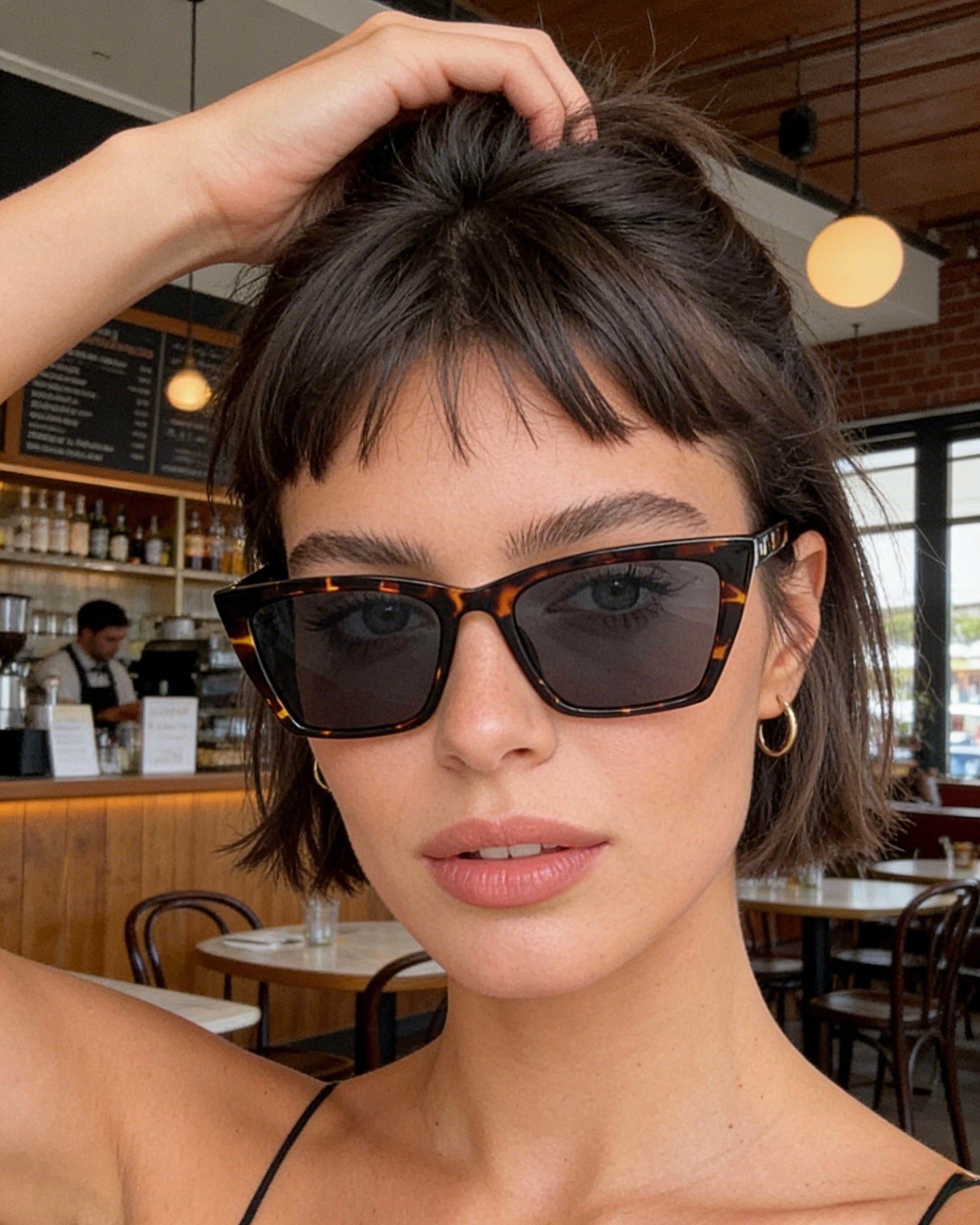 Pink Baby Levi sunglasses with round frames and dark lenses, stylish eyewear for a trendy look.