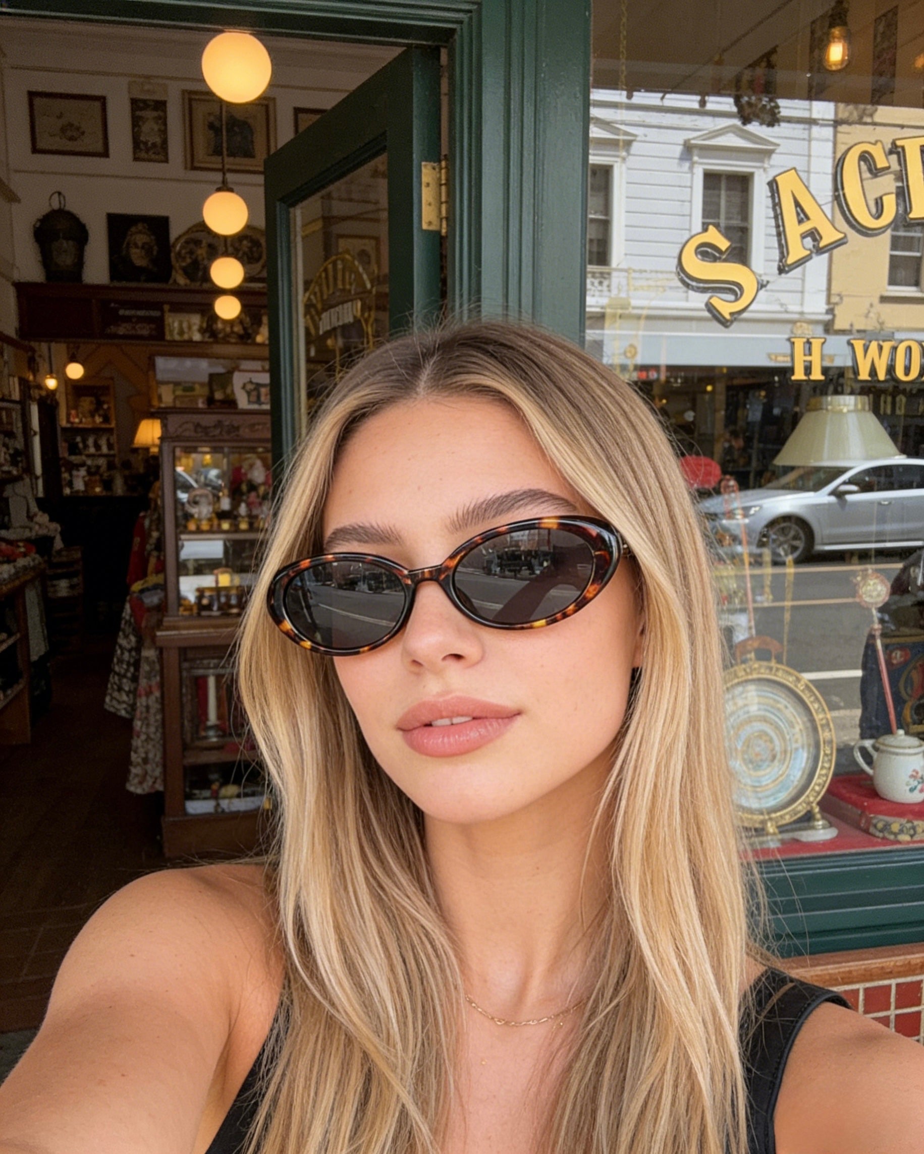 Pink Baby The Kyra tort sunglasses with round lenses and pink frame, stylish eyewear for sun protection.