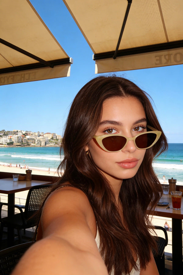 Pink Baby The Juno lemon sunglasses with yellow tinted lenses and frame, stylish and playful accessory for sunny days.