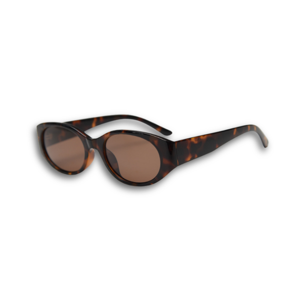Pink Baby Kairo sunglasses featuring round frames and tinted lenses, stylish eyewear for a trendy look.