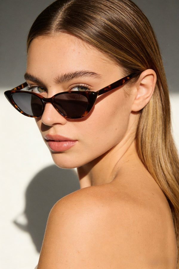 Pink Baby The Juno tort sunglasses with rounded frames and tinted lenses, stylish eyewear for sun protection.