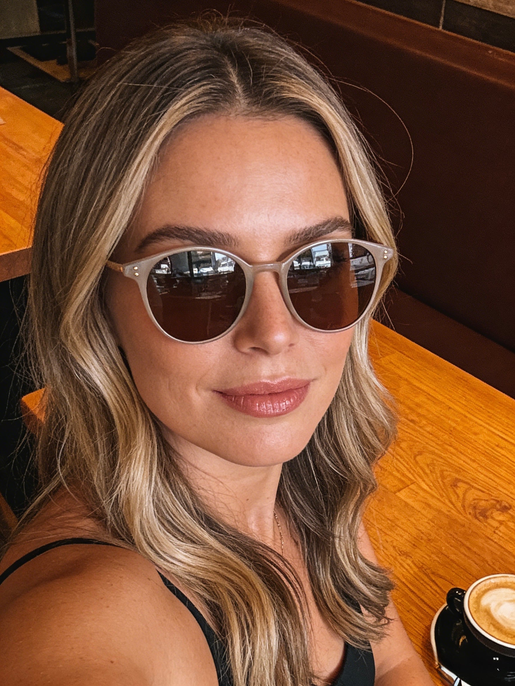 Pink Baby Avent beige sunglasses with round frames and tinted lenses, stylish eyewear for sun protection.