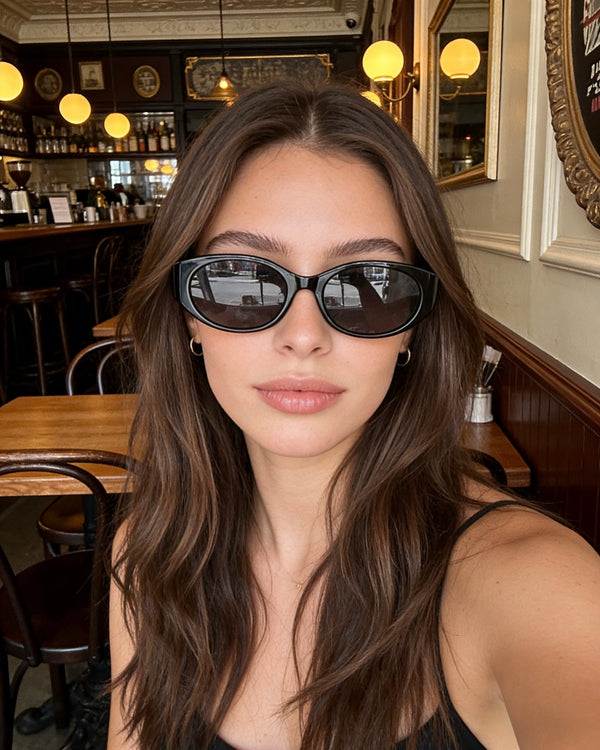 Pink Baby The Kairo black sunglasses with round lenses and thick black frames, stylish and trendy eyewear for sun protection.