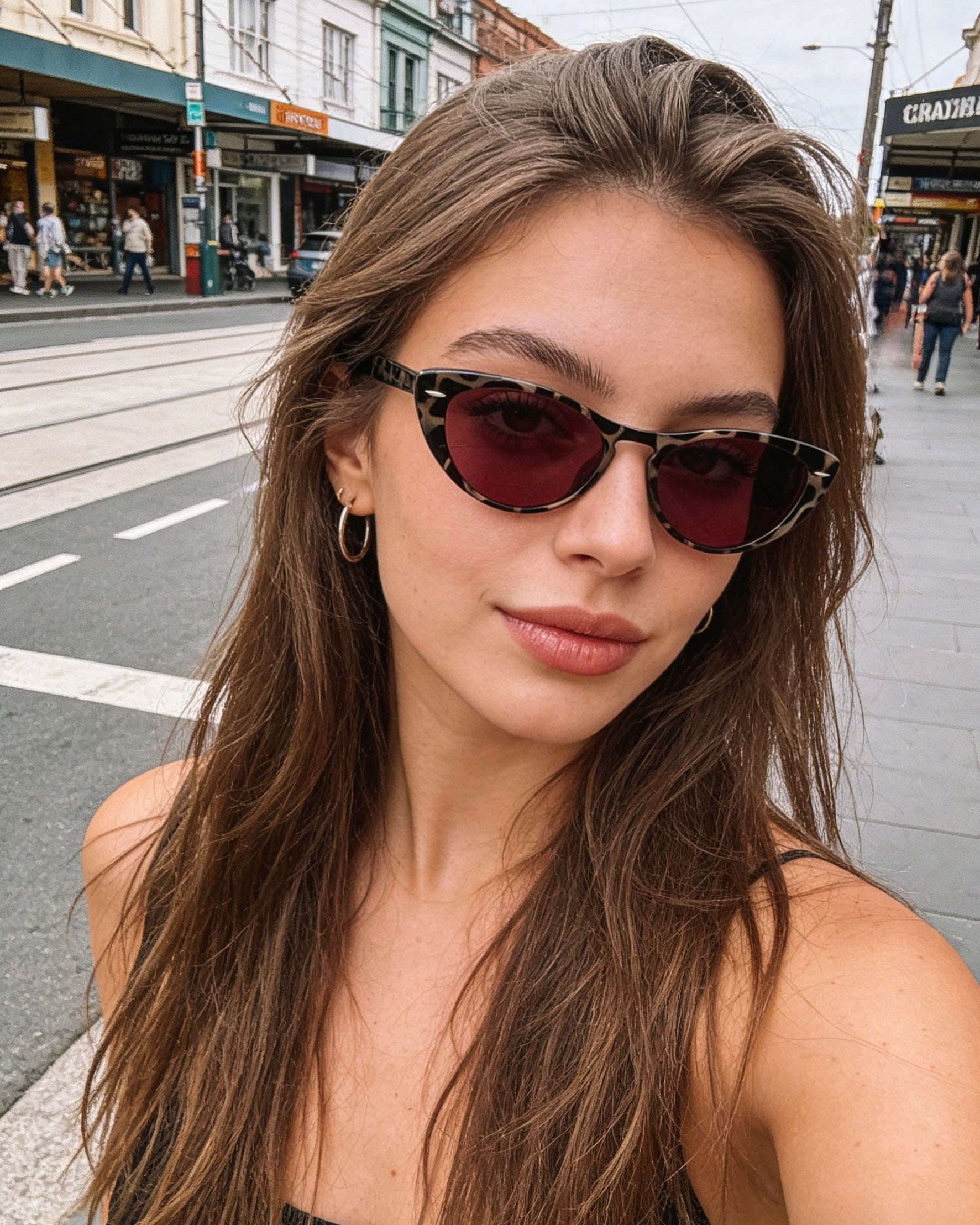 Pink Baby The Bailey tort sunglasses with rounded frames and dark lenses, stylish eyewear for a fashionable look.