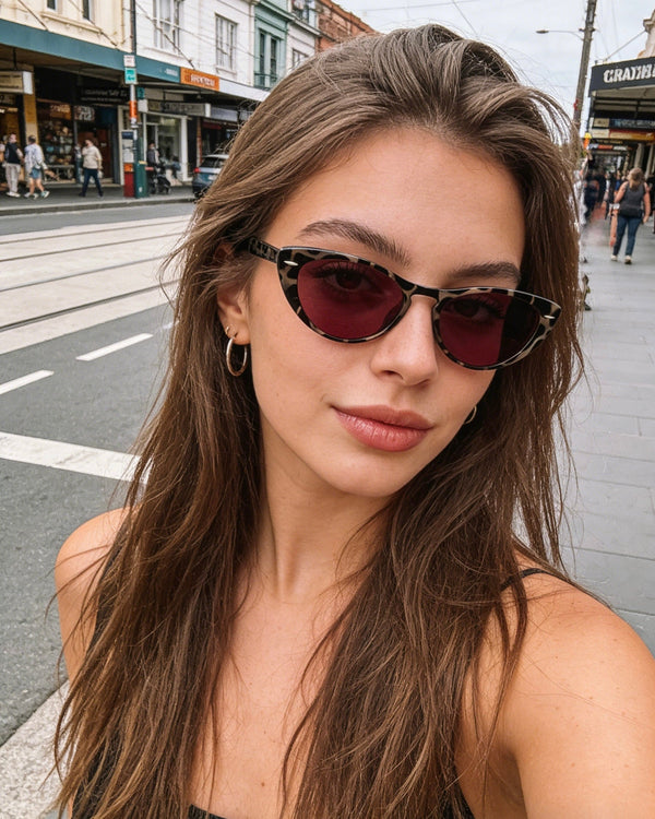 Pink Baby The Bailey tort sunglasses with rounded frames and dark lenses, stylish eyewear for a fashionable look.