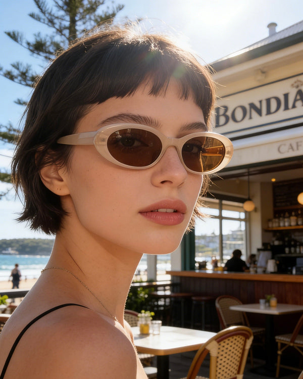 Pink Baby The Kiara cinnamon sunglasses with round frames and tinted lenses, stylish accessory for sun protection.