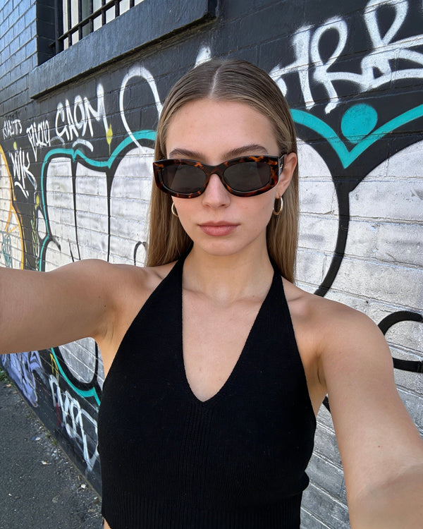 Pink Baby The Moxie sunglasses with pink frames and dark tinted lenses, stylish and protective eyewear for casual wear.