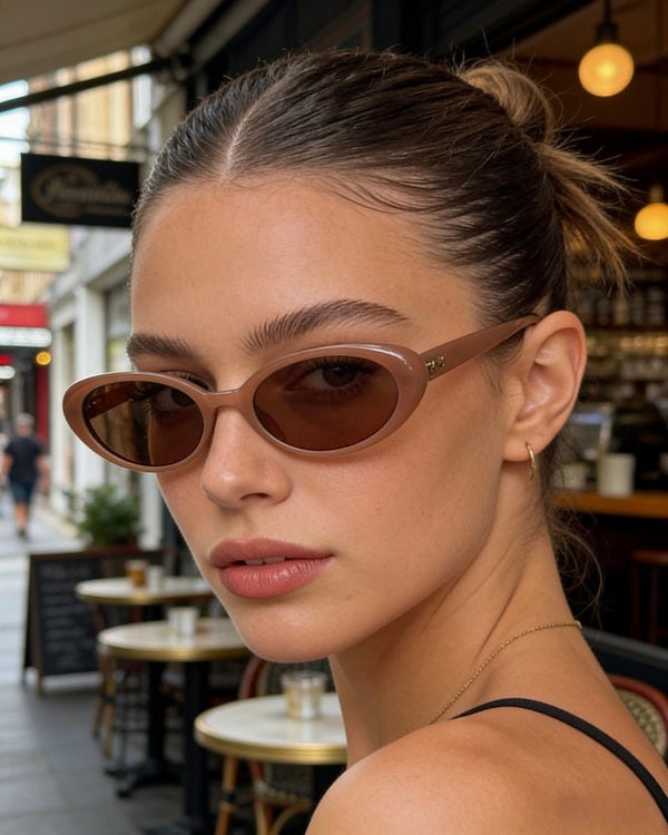 Pink Baby The Kyra cinnamon sunglasses with round frames and tinted lenses, stylish eyewear for sun protection.