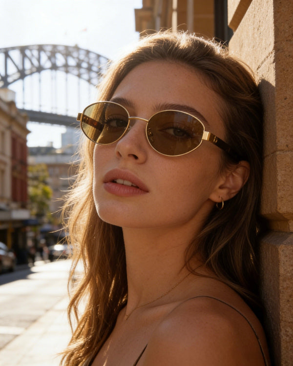 Pink Baby Hollis sunglasses in tortoise shell with round frames and tinted lenses, stylish eyewear accessory.