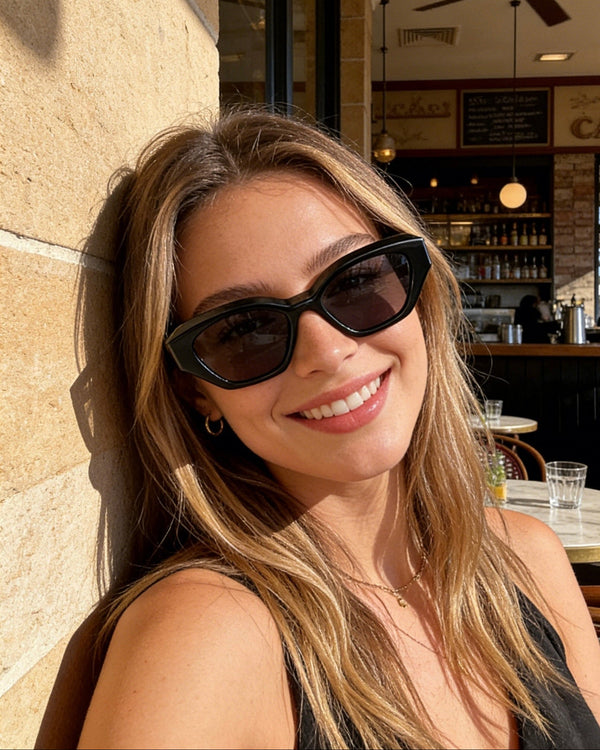 Pink Baby The Jamie black sunglasses with rounded frames and dark lenses, stylish eyewear for a modern look