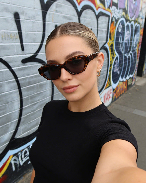 Pink Baby The Jamie tortoiseshell sunglasses with round frames and dark lenses, showcasing stylish eyewear for fashion-forward looks.
