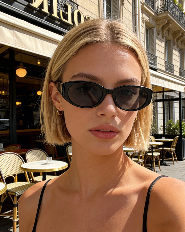 Pink Baby The Kairo black sunglasses with sleek frames and tinted lenses, stylish eyewear for sun protection.